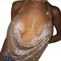 Glamorous Fitted Halter Top For Club, Chic Gold Halter Top For Party, Gold Backless Halter Top, Elegant Halter Neck Top With Sequins, Elegant Sequined Halter Neck Top, Glamorous Gold Halter Neck Top, Glamorous Rhinestone Halter Top For Party, Silver Halter Top For Summer Evenings, Elegant Fitted Halter Top For Clubbing