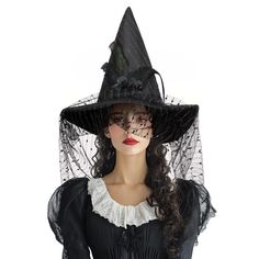 a woman wearing a black witches hat