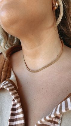 The Snake Chain Choker Necklace in Gold is a chic and versatile accessory for enhancing your outfit. Snake chain Choker Gold Patch Cardigan, Choker Necklace Gold, Choker Gold, Everyday Chic, Trendy Fall Outfits, Gold Choker Necklace, Gold Snake, Chain Choker Necklace, The Snake