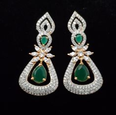 "These American Diamond earrings set has an excellent finish and gives out an exquisite sense of style. The gold covering Semi-precious Ruby, Emerald Danglers have a high-quality diamond-sparkle finish on the earrings. If you are looking for an amazing Fashion Jewelry set for special occasions such as Anniversary, Engagement, Party, Wedding, or for gifting, then your search ends here. Earring Length: 1.5\", Earring Width: 0.5\" , Weight of Single Earring: 0.570 Oz / 16gm * Packed in a box, Ideal Gold Hand Set American Diamond Earrings, Gold Hand Set Earrings With Synthetic Diamond, Gold Diamond Earrings With Hand-set Stones, Gold Diamond Earrings With Hand Set Stones, Hand-set American Diamond Gold Earrings, Gold Earrings With Diamond Accents For Festive Occasions, Festive Gold Earrings With Diamond Accents, Classic Gold Earrings Hand Set, Gold American Diamond Earrings For Anniversary