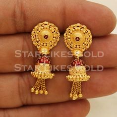 Elevate your style with these beautifully handcrafted gold earrings. Featuring a classic design and a comfortable fit, they add a refined touch to any look. Ideal for everyday wear or special occasions, they bring a subtle yet sophisticated sparkle. 22K Gold Earrings Metal is Real Gold Purity is 22kt Weight is 7.69 grams approx. Max Length is 3.6 centimeter approx. Max width is 1.3 centimeter approx. The earrings come with normal backs if you real gold screw please contact Please feel free to as Luxury Fusion Yellow Gold Jhumkas, Luxury Yellow Gold Jhumkas As Gift, Luxury Gold-plated Chandbalis For Celebration, Luxury Gold Chandbalis For Ceremonial Occasion, Cheap Gold Temple Jewelry Danglers, Old Buttalu Earrings Gold, Luxury Gold Chandbalis For Festivals, Long Buttalu Earrings Gold, Bugdi Earrings Gold