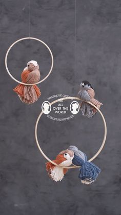 three birds are hanging from the hoop