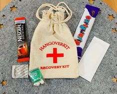 the contents of a travel kit are laid out in a bag on top of a table