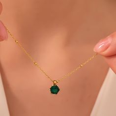 "Emerald Birthstone Jewelry which we offer as 925 Sterling Silver or 14K Solid Gold is the perfect gift for mothers day. The gold Birthstone pendant for mom 14K solid version also comes with a 14K solid gold chain. This gold handmade jewelry silver or gold has the perfect quality.  PRODUCT HIGHLIGHTS  Our birthstone necklace for women is crafted from high quality 925 Sterling Silver or 14K Solid Gold This tiny birthstone gifts can be personalized with your or your loved ones names. Please contact us using Etsy messages for further customization requests. Available in Sterling Silver, Gold and Rose Gold Colors for Sterling silver version. For 14K Solid Gold Version, White Gold, Yellow Gold and Rose Gold is available.  HOW TO ORDER   Please choose your necklace material and color from the dr Gold Plated Emerald Necklace As A Fine Jewelry Gift, Dainty Green Gemstone Birthstone Necklace, Dainty Green Necklace As Gift For Her, 17 Jewels Gold Plated Emerald Necklace As Gift, Gold Plated Round Emerald Necklace, Round Gold Plated Emerald Gemstone Necklace, Round Gold Plated Emerald Necklace, Gold-plated Round Emerald Necklace, Fine Jewelry Necklace With May Birthstone