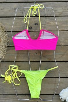 CLICK "ADD TO CART" TO GET YOURS! Dive into the season with our vibrant bikini collection! Featuring bright colors that capture the essence of spring and summer, each piece is designed to add a splash of fun to your beach days. Embrace the sunshine in style with a bikini that's as lively and playful as your summer adventures. Details Color: Pink/Neon Yellow Style: Sexy Pattern Type: Plain Details: Tie Back Bottom Type: Tie Side, with Roached Back Bra Type: Triangle Neckline: Halter Fabric: High Modest Tankini, Yellow Style, Pink Neon, Spring Fling, Bra Types, Summer Adventures, Yellow Fashion, Beach Days, The Sunshine