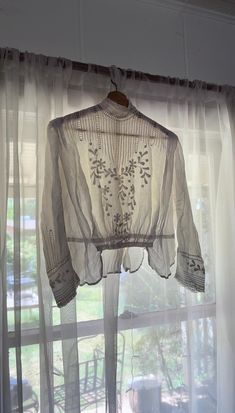 an incredibly beautiful antique blouse from early 1900s. features a high neck, floral embroidered front bust and sleeves,   tucking detail at small of waist,  and tiny button closure all the way up back. trimmed with a very beautiful peplum.  tiny  tucking details around front, back and shoulders  with strips of dainty paneled  crochet. tiny metail flats on small of back for hooks to wear with an antique skirt. in great vintage condition consistent with age - some holes on front and side. all or Formal Long Sleeve Tops With Intricate Embroidery, Fitted Victorian Tops With Lace Collar, White Fitted Victorian Blouse, Fitted White Victorian Blouse, Fitted Vintage White Blouse For Daywear, Traditional Fitted Blouse For Daywear, Fitted Traditional Blouse For Daywear, Victorian Fitted Blouse With Lace Collar, Victorian Lace Collar Blouse For Spring