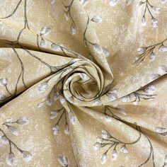 a close up view of a fabric with flowers and leaves on it, in beige