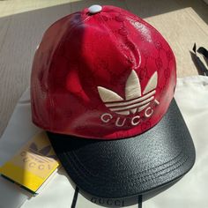 Brand New Gucci X Adidas Collaboration Red And Black Coated Canvas All Over Gg Monogram Baseball Cap. Designer Baseball Cap For Streetwear, Designer Streetwear Cap, Gucci Luxury Hat With Curved Visor, Gucci Luxury Curved Visor Hat, Luxury Baseball Cap With Logo And Curved Brim, Designer Gucci Baseball Cap With Embroidered Logo, Luxury Snapback Hat With Logo, Luxury Logo Snapback Hats, Luxury Baseball Cap For Streetwear