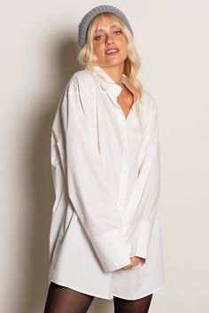 Who doesn't need a crisp oversized button down and in a dress no less? The Ultimate Oversized Button Down Shirt Dress features a crisp cotton fabrication with oversized fit, front pocket, extra long sleeves and button cuff. The ultimate layering piece! Color: White Oversized Button Front Extra Long Button Cuff Sleeve 100% Cotton Model Wearing Size Medium/Large and is 32A Bust, 5'7" Tall Classic Oversized Shirt For Daywear, Oversized Solid Shirt Dress For Fall, Oversized Shirt With Button Closure And Fold Down Collar, Oversized Shirt Dress With Buttons, Chic Shirt Dress With Rolled Long Sleeves, Chic Long Sleeve Shirt Dress With Rolled Sleeves, Oversized Solid Color Shirt Dress For Work, Classic Long Sleeve Shirt Dress With Button Cuffs, Oversized Solid Shirt Dress For Work