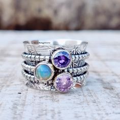 Welcome In USARingStore Title -Opal, Amethyst Spinner Ring, 925 Sterling Silver Ring, Spinning Ring, Three Stone Spinner Ring, Meditation Ring, Handmade Ring, Gift For Her Welcome In USA Ring Store PRODUCT DESCRIPTION Spinner Ring, 925 Sterling Silver, Meditation Fidget Ring,Wide Band Ring, Chunky Ring, Worry ring, Thumb ring, PRODUCT DESCRIPTION Material - 925 Sterling Silver My Shop Link :- https://www.etsy.com/in-en/shop/Bijouxsilverart/edit?ref=seller-platform-mcnav Ring Size - All Measureme Bohemian Sterling Silver Opal Birthstone Ring, Sterling Silver Multi-stone Opal Ring As Gift, Unique Sterling Silver Stackable Opal Ring, Welcome In, Ring Spinning, Funky Rings, Ring Three Stone, Spinning Ring, Meditation Ring