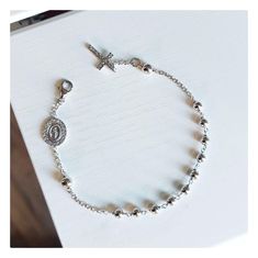 This beautiful rosary bracelet is made of sterling silver 925, with zircon cross and double sided Miraculous Medal encrusted with zircons. The specialty of this bracelet is in the fine details that make it perfect and shiny. This beautiful elegant bracelet is an ideal gift for catholic women on all occasions.  If you want to have a bracelet with a deeper meaning, this one is ideal for you Due to its simplicity, it can be worn every day and is easily combined with other jewelry. Item details:  Lenght of bracelet:  18 cm plus 1,5 cm  Width of bead :4  mm Weight of bracelet: 4,1 gr For any religious occasions. If you want to see the rest of our selection of beautiful bracelets, follow this link: https://www.etsy.com/shop/MedjugorjeJewelry?ref=shop_sections_curr&listing_id=1344945334§ion_id=40 Elegant Silver Cross Beaded Bracelets, Elegant Silver Beaded Cross Bracelets, Sterling Silver Spiritual Rosary Bracelet With Cross, Sterling Silver Cross Rosary Bracelet, Spiritual Sterling Silver Cross Rosary Bracelet, Elegant Sterling Silver Cross Rosary Bracelet, Silver Cross Rosary Bracelet, Adjustable Silver Cross Rosary Bracelet, Elegant Sterling Silver Crucifix Rosary