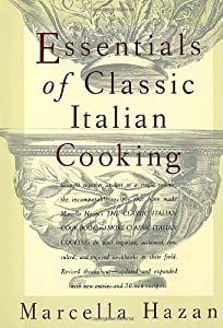 the book cover for essentials of classic italian cooking