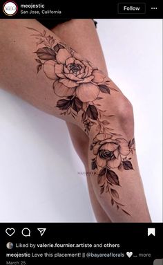 a woman's leg with flowers and leaves on it