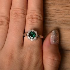 It is a lab emerald ring. The main stone is 7mm*7mm round cut, weight about 1.30 carats. The basic metal is sterling silver and plated with rhodium. To change the metal to a solid gold (white/rose) or platinum is also available, please ask for a quotation if you want. You can also go to my shop Home for more elegant rings: https://www.etsy.com/shop/godjewelry?ref=hdr_shop_menu More emerald rings: https://www.etsy.com/shop/godjewelry?ref=hdr_shop_menu§ion_id=20709240 Customization is always welco Rainbow Topaz Ring, Elegant Rings, May Birthstone Rings, Rainbow Topaz, Emerald Rings, June Birthstone Ring, Silver Engagement Ring, Spinel Ring, Sterling Silver Engagement Rings