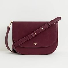 A thoughtfully designed, spacious messenger bag crafted from certified vegan leather in a rich burgundy. This bag strikes the perfect balance between style and utility, making it a versatile choice for both work and casual use. It features an adjustable cross-body strap, a convenient zipped inner pocket, and a secure magnetic fastening to ensure your essentials are well-protected. We also have the same bag in tan, and a smaller saddle bag in the same colourways Key features: Approx. 29 (L) x 21 Office Burgundy Shoulder Bag With Adjustable Strap, Burgundy Crossbody Shoulder Bag For Office, Versatile Satchel Saddle Bag For Work, Workwear Satchel Saddle Bag With Adjustable Strap, Satchel Saddle Bag With Adjustable Strap For Work, Workwear Saddle Bag With Adjustable Strap, Burgundy Leather Crossbody Flap Bag, Business Shoulder Bag With Detachable Strap In Burgundy, Classic Burgundy Shoulder Bag With Adjustable Strap