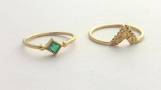 "A beautiful set of 2 matching 14k yellow gold rings, one of them with a green emerald. This set consists of two rings: one ring is 14K and a square natural green emerald ring, with two little gold dots at opposite corners, the other one is an ornamented ethnic triangle ring. The rings fit together perfectly and complement each other. This boho ring set is delicate and unique and will be a great choice for a special occasion gift or as an alternative and modern engagement ring. This set is light Gold Emerald Stackable Rings For Wedding, Gold Emerald Stackable Wedding Rings, Gold Stackable Emerald Ring For Wedding, 14k Gold Stackable Emerald Cut Rings, Gold Stackable Diamond Ring, Gold Stackable Emerald Ring For Formal Occasions, Gold Stackable Emerald Ring, Dainty Gold Ring With Emerald, Dainty Gold Emerald Cut Emerald Ring