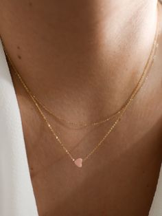 "𝗘𝗮𝘀𝘆 𝗧𝗼 𝗦𝘁𝘆𝗹𝗲, 𝗠𝗮𝗱𝗲 𝗧𝗼 𝗟𝗮𝘀𝘁 A perfect Valentine's Day gift, our dainty rose quartz gemstone necklaces are easy to layer and ready to be worn on repeat! Created to last a lifetime, these necklaces will remain evergreen even as the years and trends come and go. 𝗠𝗮𝘁𝗲𝗿𝗶𝗮𝗹𝘀 𝗪𝗲 𝗨𝘀𝗲 This necklace is made entirely with sturdy 14k yellow gold filled or sterling silver pieces and a genuine gemstone pendant. It is safe to wear in the shower, but we recommend avoiding pro Dainty Pink Gold Jewelry For Everyday, Minimalist Gemstone Jewelry For Valentine's Day, Minimalist Gemstone Necklace For Valentine's Day, Dainty Heart-shaped Layered Necklace For Gift, Dainty Pink Jewelry With Delicate Chain, Delicate Gemstone Necklace For Valentine's Day, Dainty Layered Heart Necklace For Gifts, Elegant Layered Necklace For Valentine's Day Gift, Dainty Rose Gold Heart Beads Necklace