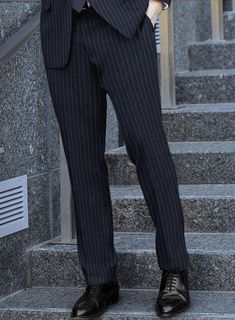 Make a sartorial statement that distinguishes you from the crowd and exudes unmatched style by choosing our exceptional Italian Afito Indigo Blue Chalkstripe Flannel Suit. Meticulously crafted from Super 120's wool, this suit boasts a refined striped pattern, adding an air of sophistication to your ensemble. Its sumptuously soft fabric provides comfort and a gentle embrace of warmth, making it an ideal choice for any occasion. Whether you need a professional regalia for the office or a laid-back Chic Striped Suits With Notch Lapel, Chic Striped Suits For Office, Chic Striped Notch Lapel Suit, Chic Pinstripe Suits For Business, Chic Striped Business Suits, Elegant Striped Suits For Business Casual, Chic Pinstripe Business Suits, Elegant Fitted Pinstripe Pants, Chic Pinstripe Suits With Notch Lapel