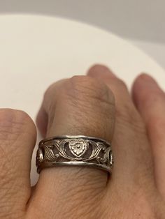 Vintage Wedding band or thumb ring. Size 8 925 Sterling Silver Tarnished with age 925 Sterling Filigree Setting Handmade Can be resized, my jeweler charges $10-$20 All rings are shipped free in the US in a nice gift box. Check out our over a THOUSAND great reviews!!! Engraving is $4 per letter and is not always perfect depending on the piece. It can take a few days if the jeweler is busy. This is payable to Paypal Judithsltd@gmail.com Sterling Silver Heirloom Jewelry With Round Band, Heirloom Style Sterling Silver Round Band Jewelry, Heirloom Sterling Silver Round Band Jewelry, Heirloom Style Sterling Silver Jewelry With Round Band, Antique Wide Band Engraved Jewelry, Antique Engraved Wide Band Jewelry, Heirloom Sterling Silver Jewelry For Anniversary, Silver Open Band Promise Jewelry, Etched Promise Ring Jewelry