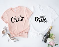 two t - shirts with the words i do crew and bride on them next to high heel shoes