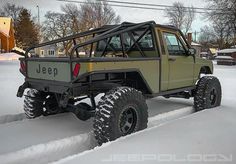 an off road vehicle is parked in the snow