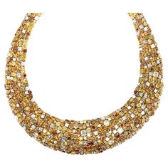 Oscar Heyman gold platinum fancy color diamond necklace 95 cut corner square diamonds of 13.47 carats, 21 princess cut diamonds of 2.60 carats, 36 square diamonds of 2.93 carats, 571 assorted shapes fancy color diamonds of 121.15 carats, and 127 Swiss cut orange/yellow fancy color diamonds of 4 carats; marked OHB, 18k, plat, 601955 Size: width 1.25 inch (thickest part), inner circumference 16 inches Total weight: 164.1 grams Comes in original box Purchased in 2014 for $620,000