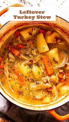 a pot filled with stew and potatoes on top of a white tablecloth next to bread