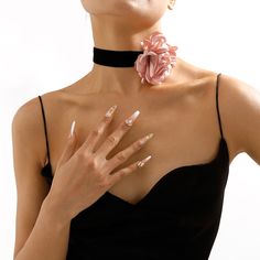 Add drama to your look with this natural-inspired choker necklace that features a bold floral accent. Choker: 12.99" L with 3.94" extender Rose: 3.35" diameter Lobster claw clasp Silver-plated copper / nylon / polyester Chic Flower Necklaces For Party, Chic Flower Necklace For Party, Chic Flower Shaped Party Necklace, Rose Gold Flower Necklace For Parties, Spring Party Necklace With Flower Charm, Trendy Flower Shape Necklaces For Party, Trendy Flower Necklaces For Party, Trendy Flower Necklace For Party, Flower Pendant Necklace For Party