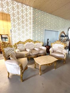 a living room with couches and chairs in the middle of an empty flooring area