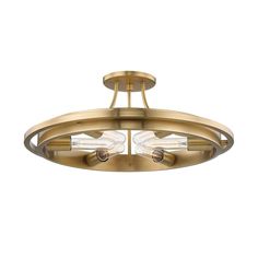 two light semi flush ceiling fixture in an antique brass finish with clear glass shades on the sides