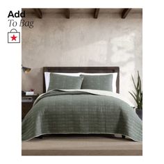 an image of a bed in a room with green sheets and pillows on the bed