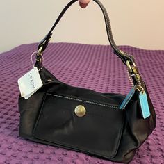 Coach Nwt Black Hobo Shoulder Bag. Blue Interior. Original Blue Coach Leather Purse Tags New With Tags Attached Very Good Condition- Never Used, No Stains! Please Note: Some Signs Of Wear From Being In Storage Please See Photos. (Small Distressed Areas) Approx. 9”Long X5” Tall X4” Deep Hand Or Shoulder Purse Zipper Closure, Inside And Outside Pockets On-the-go Shoulder Bag With Snap Closure, Elegant Shoulder Bag With Snap Closure For On-the-go, Coach Rectangular Shoulder Bag With Snap Closure, Coach Rectangular Bag With Snap Closure, Coach Shoulder Bag With Snap Closure, Coach Satchel With Snap Closure, Chic Coach Shoulder Bag With Snap Closure, Elegant Coach Shoulder Bag With Snap Closure, On-the-go Hobo Bag With Snap Closure