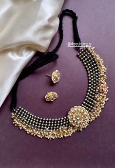 Unique Silver Black Oxidized Base Fusion Necklace studded with Ahmedabadi high quality Kundan Center Motif in gold finish surrounded by clusters pearls. This necklace choker comes with cute kundan studs with push screw. Drawstring Dori is adjustable. Perfect to go with any ethnic Indian wear.  💥Super Trendy 💥Kundan Earrings - 3/4th inches in diameter. ✅Check other styles available in our store https://www.etsy.com/shop/KKsCulture We want you to LOVE your new jewelry!  CARE TIP  1. Keep away fr Ceremonial Dual-tone Kundan Necklace, Oxidized Choker, Ethnic Indian Wear, Kundan Studs, Jewelry Victorian, Victorian Necklace, Kundan Necklace, Kundan Earrings, Hippie Necklace