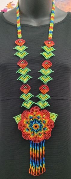 "This one of a kind necklace is handmade by a female artist in Sololá, Guatemala. The flower motifs used in Mayan tradition are usually the native flowers of Guatemala. They bloom abundantly throughout the year and are symbols of life and fertility. The necklace is non-adjustable and the total length is 22\" from the mid-top to mid bottom. The beads are imported glass Czech seed beads. The women who design and create these pieces are part of a Women's Collective who live in villages around Lake Atitlán in Guatemala. They gather in order to continue the traditions and teach the next generation about their heritage. Thank you for your support!" Symbols Of Life, Bold Statement Necklaces, Boho Style Necklaces, Silver Strand, Beaded Collar Necklace, Native Flowers, Flower Motifs, Princess Necklace, Female Artist