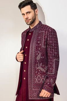 Maroon full sleeves longline bundi with all over Paisley bloom embroidery using sequin and thread highlights. Paired with a cross cut embroidered mandarin collar kurta and a pant. - Aza Fashions Traditional Fit Long Sleeve Sherwani With Chikankari Embroidery, Bollywood Style Sherwani With Long Sleeves, Festive Long Sleeve Traditional Fit Sherwani, Traditional Fit Sherwani With Resham Embroidery And Long Sleeve, Traditional Sherwani With Resham Embroidery And Long Sleeves, Traditional Fit Bandhgala With Zari Work And Long Sleeves, Traditional Fit Long Sleeve Bandhgala For Festivals, Festive Traditional Fit Bandhgala With Long Sleeves, Festive Bandhgala With Long Sleeves