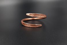 This is an adjustable, massive bracelet made of raw and pure copper.  The Dacian inspiration model symbolizes the ears of wheat. The bracelet is rigid. Circumference between 16-23 cm It can be made to order, any size. Wearing copper jewelry can leave greenish marks on the skin, that can be cleaned with soap and water. Wearing copper jewelry can stimulate healing, especially due to its ability to balance polarities or, in other words, the flow of projective and receptive energies. Nowadays, jewel Copper Jewelry Benefits, Thyroid Gland, Wound Healing, Healing Jewelry, Copper Bracelet, Hammered Copper, Pure Copper, Copper Jewelry, How To Make Ornaments