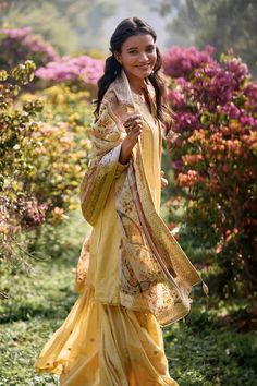 Yellow kurta with mughal woven motifs and mirror, bead embroidered border. Paired with sharara and leaf border woven dupatta. - Aza Fashions Festive Tussar Silk Palazzo Set With Straight Kurta, Festive Tussar Silk Palazzo Set With Resham Embroidery, Traditional Palazzo Set With Dupatta And Straight Kurta, Semi-stitched Jamawar Sharara With Gota Work, Festive Resham Embroidered Tussar Silk Palazzo Set, Anarkali Tussar Silk Sharara With Gota Work, Chanderi Palazzo Set With Straight Kurta And Dupatta, Bohemian Semi-stitched Sharara For Festive Occasions, Transitional Unstitched Tussar Silk Palazzo Set