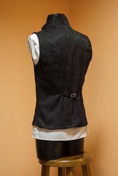 Stylish double-breasted men's black vest made of high-quality jacquard with viscose lining. Lapels and collar - from cotton velvet. Decorated with dark silver buttons. The waist can be adjusted from the back. The collar can be worn as a stand or as a turn-down. Will be perfect for victorian or vampire wedding, photoset, also it could be worn as a part of a historical costume. The vest is made to order. Please, tell us the following measurements: - Height - Chest - Waist - Hips ♥ See all costumes Button Up With Vest, Victorian Vest, Mens Black Vest, Vampire Wedding, Wedding Gothic, Victorian Style Wedding, Edwardian Costumes, Steampunk Vest, Elven Dress