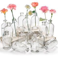 PRICES MAY VARY. YOUEON set of 16 living bud vase measure 5.1"H x 2.4"D, bud bottles have a thin neck and sturdy base to stand well and easily being held. Sufficient quantities are enough to meet your need. Wide range of uses: This glass vase set can be used for long-stemmed flowers or as centerpieces for home decorations, farmhouse home decor, table decor, wedding, party, hotel, restaurant, cafes. It can also be used as an alternative to diffuser bottles and diffuser containers, put in essentia Milk Bottle Flowers, Vases Clear, Bud Vase Centerpiece, Office Table Decor, Long Stem Flowers, Bottle Centerpieces, Table Centerpiece Decorations, Glass Flower Vase, Flower Bottle