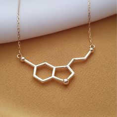 10k 14k Solid Gold Serotonin Molecule Necklace,Dainty Gold Molecule Pendant, Serotonin Charm Necklace,Christmas Gift Necklace,Necklace For Women The necklace is made with 10k 14k solid gold.. All the pieces in the necklace are solid gold..                                                              We use lobster clasp on the chain..         The chain thickness is 0.85mm.      Pendant height: 16 mm  Pendant width : 29 mm The chain is produced adjustable..  For example: 22 inches adjustable 21 i Serotonin Molecule, Molecule Necklace, Birthday Necklace Gift, Necklace Necklace, Necklace Dainty, Necklace For Women, Necklace Gold, Gift Necklace, Lobster Clasp