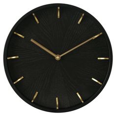 a black clock with gold hands on a white background