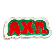 a red and green plate with the word axa on it's bottom, against a white background