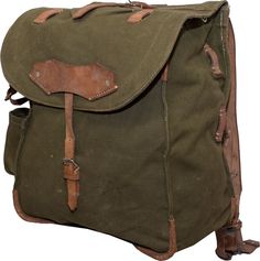 This genuine Romanian Military Rucksack with leather straps is the rucksack you�ve been looking for. This vintage rucksack was thoughtfully designed for harsh use in the Romanian Military, but still has the rustic yet sophisticated look. Constructed of heavy-duty cotton blend canvas, adjustable leather shoulder straps, drawstring close main area, and an open side pocket with drainage gromet. Has plenty of straps for attaching a mess kit, tools, sleeping bag or anything else to complete your load Vintage Backpack With Leather Handles For Everyday, Vintage Canvas Satchel Backpack, Vintage Canvas Backpack With Adjustable Strap, Vintage Leather Backpack With Leather Patch For Adventure, Vintage Travel Backpack With Leather Handles, Vintage Backpack With Leather Backing, Vintage Backpack With Leather Patch, Vintage Backpack With Leather Trim, Vintage Leather Patch Backpack