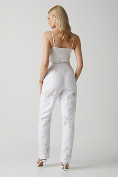 Introducing our Premium Embellished Jacquard Trousers, a stunning addition to your wardrobe. These white pants are meticulously embellished with intricate gold and silver details, adding a touch of elegance and sophistication to any outfit. Crafted with the utmost care and attention to detail, these trousers are designed to make a statement and elevate your style. Perfect for special occasions, these trousers are a must-have for those who appreciate exquisite craftsmanship and timeless beauty. Bridal Separates, Tapered Trousers, White Pants, Fashion Face, Elevate Your Style, Gold And Silver, Timeless Beauty, Fashion Beauty, Special Occasion