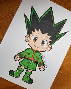 a drawing of a cartoon character with green hair and brown eyes on a piece of paper