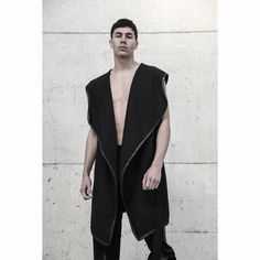 Modern Fitted Black Vest, Modern Black Fitted Vest, Black Asymmetrical Vest For Fall, Futuristic Black Outerwear For Urban Adventures, Black Sleeveless Edgy Outerwear, Edgy Black Sleeveless Outerwear, Black Futuristic Sports Outerwear, Sleeveless Black Punk Outerwear, Black Sleeveless Punk Outerwear