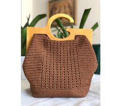 -Size : 25x25x12cm -This bag, which will be the choice of women who feel young, is made with completely natural materials. -A small gift is waiting for you Natural Crochet Bag With Round Handle For Shopping, Trendy Brown Shoulder Bag With Round Handle, Brown Shoulder Bag With Round Handle For Vacation, Everyday Crochet Tote Bag With Bamboo Handle, Rectangular Bucket Bag With Bamboo Handle For Everyday, Everyday Rectangular Bucket Bag With Bamboo Handle, Trendy Brown Square Straw Bag, Trendy Handheld Crochet Bag In Brown, Trendy Brown Handheld Crochet Bag