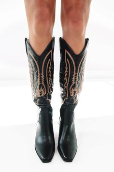 The Calvin is a long cowboy boot and the everyday boot your wardrobe needs. A hint of western meets contemporary ~ what more could we ask for? Run true to size. If in between sizes, we'd recommend sizing up. Heel height 8cm. Mid stacked block heel Soft pointed toe Western inspired flame embroidery Oversized side pull tabs for a pull on design Synthetic upper, lining and outsole Flame Embroidery, Everyday Boots, Wardrobe Needs, Cowboy Boot, On Design, Cowboy Boots, Black Boots, Block Heels, Heel Height