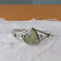 WELCOME AT KingmanJewelryCo Prehnite Bangle , Sterling Silver Bangle , Prehnite Gemstone Bangle , Handmade Bangle , Silver Bangle , Christmas Bangle , Gifts For Her  METAL = 925 STERLING SILVER GEMSTONE = PREHNITE SHIPPING = FREE SHIPPING WORLDWIDE PACKING = All Items come in a pretty Box OCCASION = birthday gift , anniversary Gift , Wedding Gift , valentine gift, Christmas gift , Thank You Very Much For Visiting My Store Please Give Me Good Review Green Bangle With Natural Stones For Gift, Green Gemstone Cuff Bracelet For Gift, Adjustable Teardrop Bracelet For Gifts, Green Nickel-free Cuff Bracelet As Gift, Handmade Teardrop Bracelets As Gift, Adjustable Green Cuff Bracelet With Natural Stones, Bohemian Teardrop Bracelets For Gifts, Bohemian Teardrop Bracelets As Gift, Silver Handmade Teardrop Bracelets