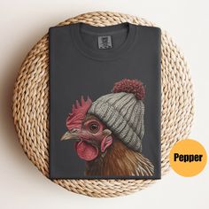 "Chicken Shirt | Farm Shirt | Farmer Shirt | Chicken Lovers Tee | Cute Bird T-Shirt | Animal Shirt | Love Chickens | Chicken Lover Gift Matching Sweatshirt: https://printworkshopcompany.etsy.com/listing/1642519904/chicken-sweatshirt-homestead-gift ** HOW TO ORDER 1. Check our photos for sizing and color options.  2. Select your size and color from the drop-down menus.  3. Click \"ADD TO CART\" to add the shirt to your cart. 4. Click \"PROCEED TO CHECKOUT\" to purchase your shirt. ** VIP Email List Be sure to join our VIP Email list for new product releases, special promotions, and giveaways! https://email.everbee.io/subscribe?shopName=PrintWorkshopCompany ** PRODUCTION TIME: 1-3 days (Usually 2 days) ** SHIPPING TIME: 2-5 days (Usually 3 days) ** DETAILS: The garment-dyed t-shirt by Comfor Novelty Cotton Tops With Screen Print, Funny Cotton Tops For Winter, Graphic Tee Cotton T-shirt For Winter, Winter Tops With Funny Print, Short Sleeve Graphic T-shirt For Winter, Cotton Tops With Funny Print For Winter, Winter Graphic Print T-shirt With Short Sleeves, Winter Graphic Print Short Sleeve T-shirt, Chicken Sweatshirt